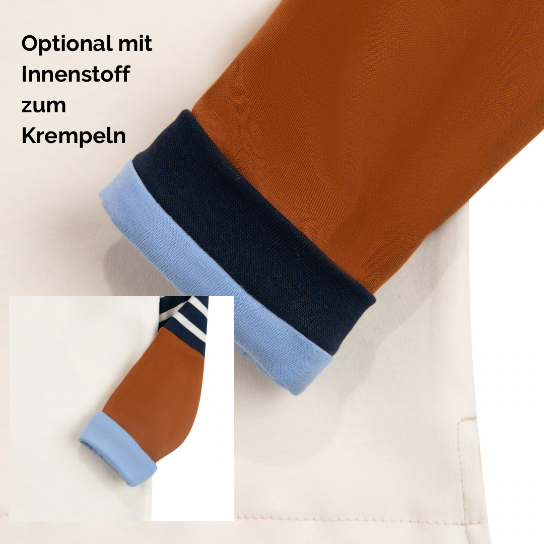 Detailansicht Alltagsbegleiter Eike. Ärmel ist umgekrempelt und zeigt ein hellblaues Futter. Text auf dem Bild „Optional mit Innenstoff zum Krempeln.“